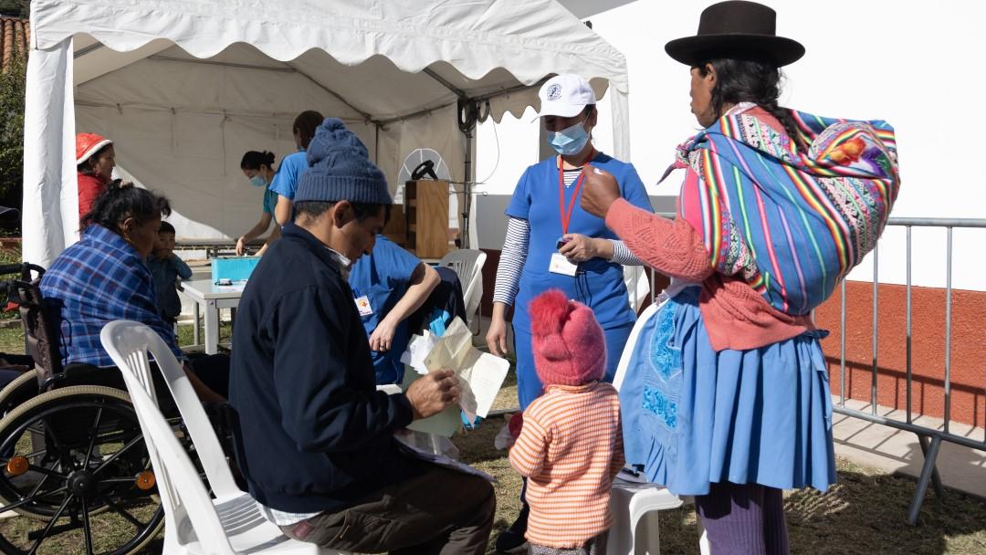 People queuing for a triage in front of Diospi Suyana Hospital 