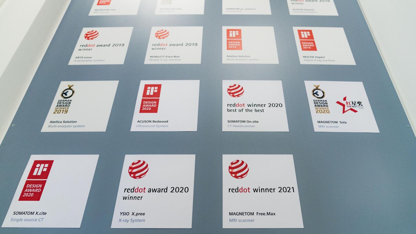 #Futureshaper: Awards won by the Industrial Design Team hang on the Award Wall. The Red Dot Design Award won for the MAGNETOM Free.Max was added in 2021. 