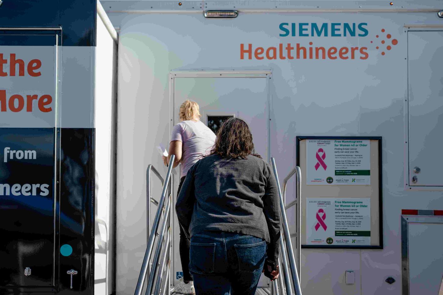 Women entering the mobile mammography unit