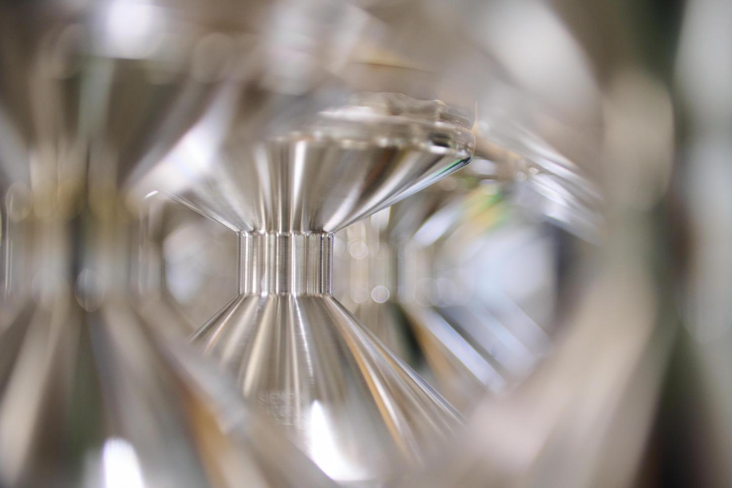 Photo from the X-ray tube recycling in the HEP Center, close-up. You can see a blurred abstract reflection on the surface of an X-ray tube.  