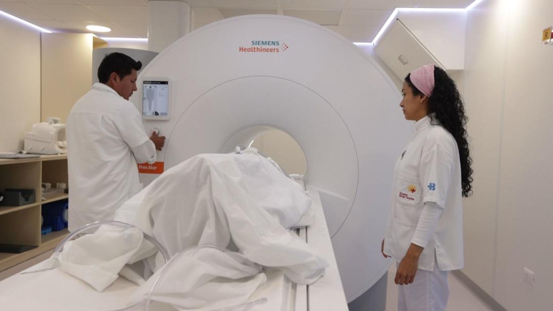 Medical staff at Diospi Suyana getting a patient ready for his MRI exam