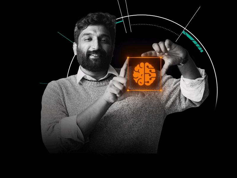 You see a man holding a graphic of a brain illustrating AI. In the back is running an animated cube illustating a hospital.