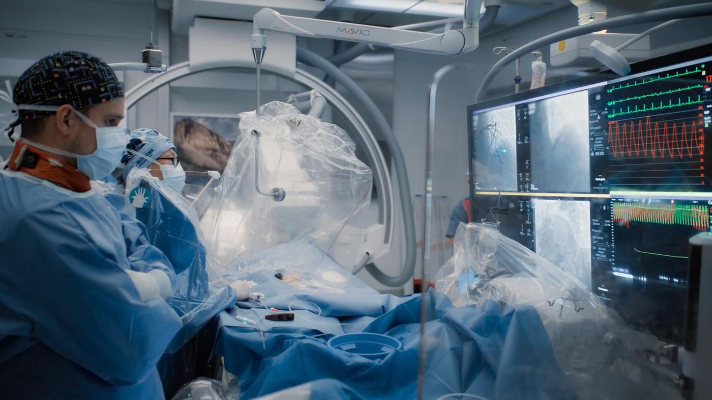 Cardiac imaging and interventional procedure in a catheterization laboratory.