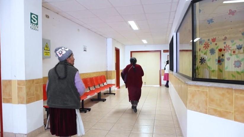 Two patients walking the corridors of Diospi Suyana in Peru