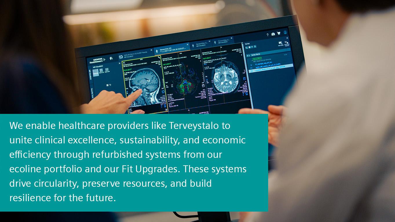 Two people examining clinical images on a screen