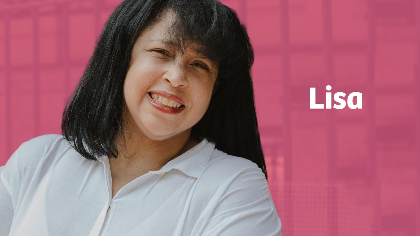 Breast cancer survivor Lisa in front of a pink background.