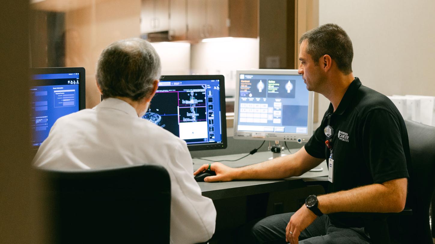 Dr. Samuel Mehr and Scott Degenhardt from Nebraska Cancer Specialists discuss PET/CT images.