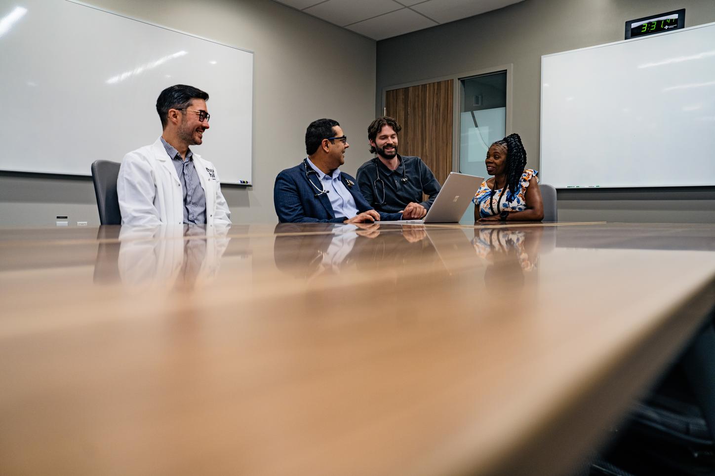 Omar Khan, MD, and colleagues discussing